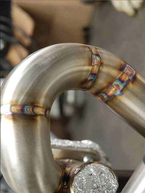 Curved metal pipe with three visible welds