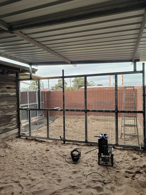 Steel framework and welded connections beneath a metal roof